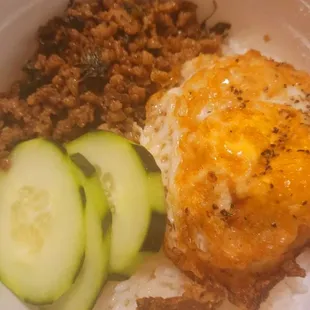 My kid's Pad Kra Prao ( ground pork with lots of basil in a rice situation with an egg).