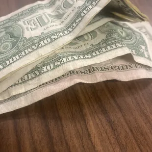 a stack of one hundred dollar bills