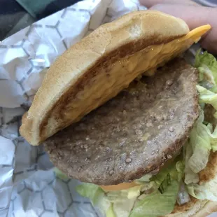 The non-grilled side of the burger.