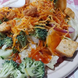 a plate of food with broccoli and cheese