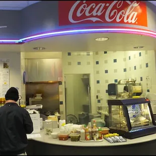 Short Stuff Cafe is tucked away in the back of the "food mart," and you have to walk past the cashier to find the restaurant.