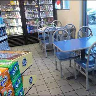 Located inside the "food mart," the dining room consists of just two small tables and a few chairs.