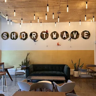 seating area with tables and chairs