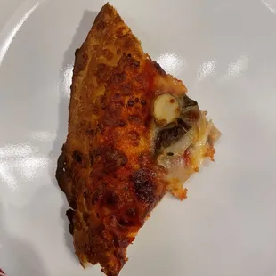 a slice of pizza on a plate