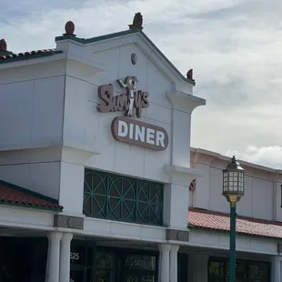 cars parked in front of the restaurant