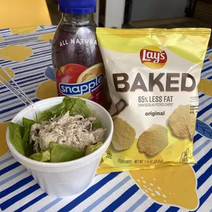 a bag of baked chips and a bowl of salad