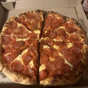 A large extreme pepperoni pizza