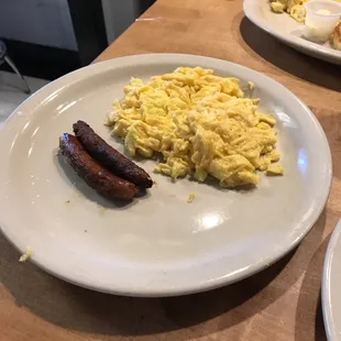 a plate of eggs and sausage