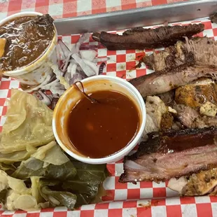Three meat plate of ribs, sliced brisket and chicken with BBQ gumbo and cabbage with BBQ sauce on the side.  (3 Meat Plate with 2 Sides)