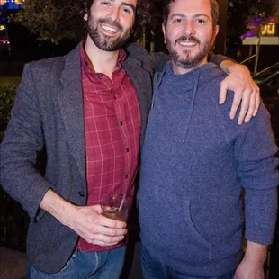 two men standing next to each other