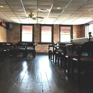 an empty restaurant with tables and chairs