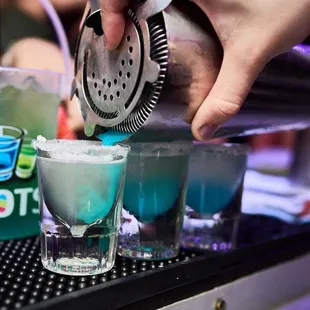 a bartender mixing a drink
