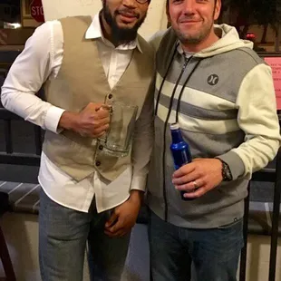 two men posing for a picture