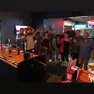 a group of people at a bar