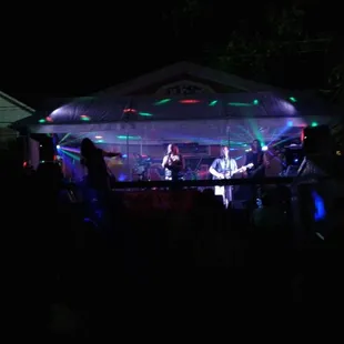a band performing at night