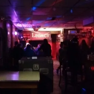 a group of people sitting at a bar
