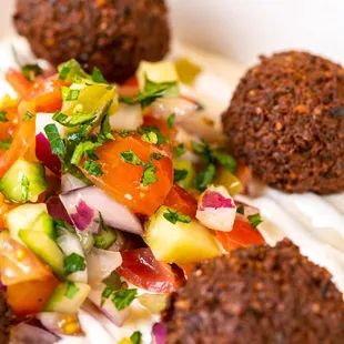 a plate of meatballs and vegetables
