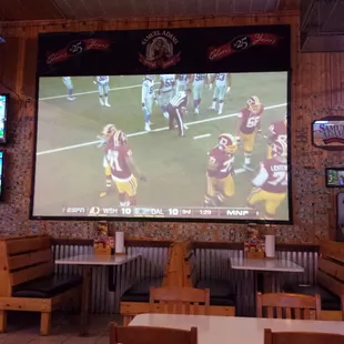 a football game on a big screen
