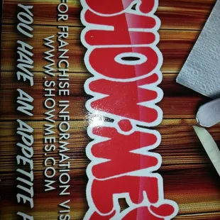 a pair of scissors next to a sign