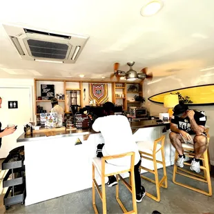 a man and a woman sitting at a bar