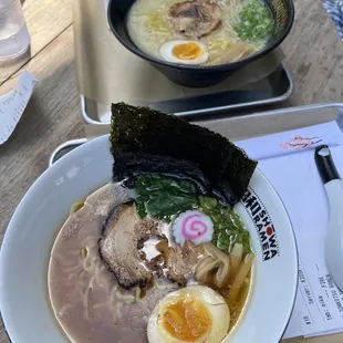 shoyu ramen (bottom left) tonkatsu ramen (top right)