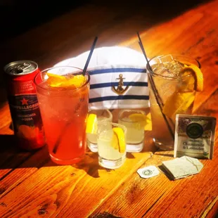 a variety of drinks on a wooden table