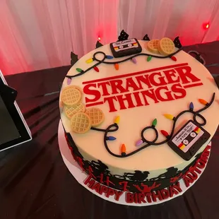 a cake with the words stranger things on it