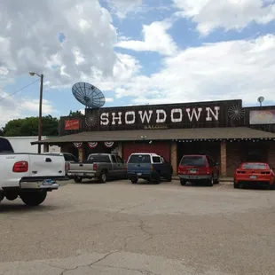a parking lot with cars parked in front of it