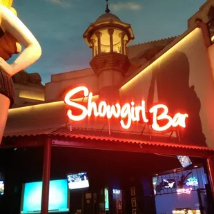 a statue of a woman in a short skirt