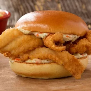 a fried fish sandwich with coleslaw
