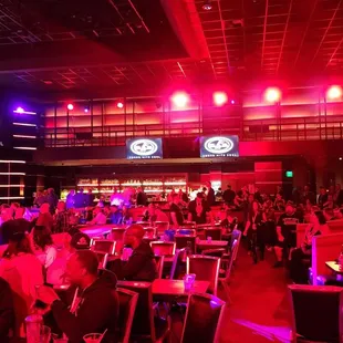 a crowd of people sitting at tables