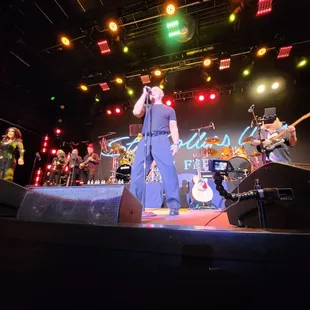 a man singing on stage