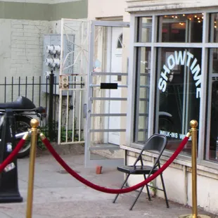 exterior view from nearby sidewalk showing roped off area and entrance next to apartment doorway