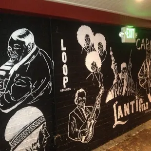 a mural of jazz musicians painted on a wall