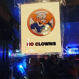 a no clown sign in the window