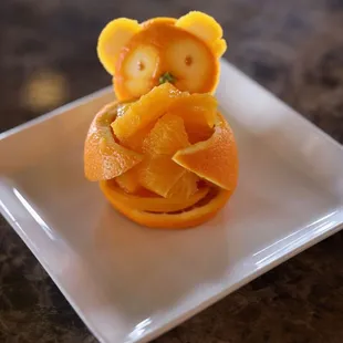 an orange on a plate