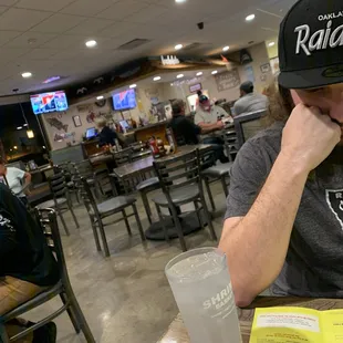 The bar and a few customers and water