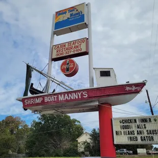 the sign for shrimp boat manny's