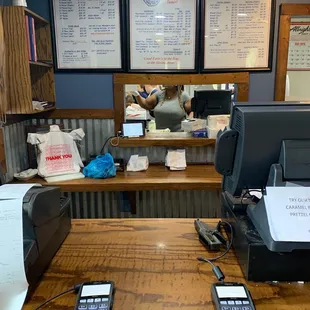 a restaurant counter with two cell phones on it