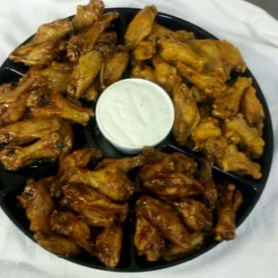 New wet wings. 4 great flavors. Dinners, sides, or party platters.