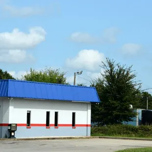 a restaurant with a blue roof