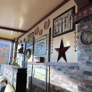 a living room with a brick fireplace