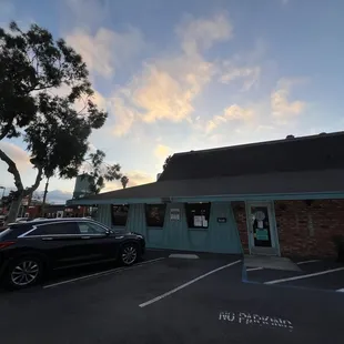 a car parked in front of a restaurant