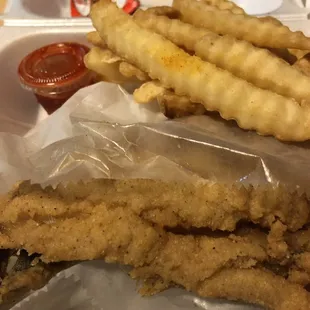 fried fish and fries with ketchup