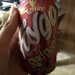 a person holding a can of food