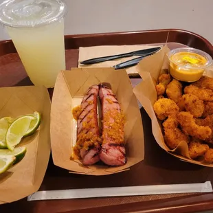 Sausages ($5.50), popcorn shrimp ($8.75) and lemonade ($5).