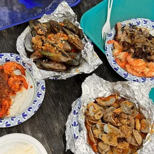 Lava garlic shrimp, steamer clams, mussels, New York steak.