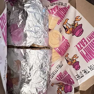 a sandwich wrapped in foil