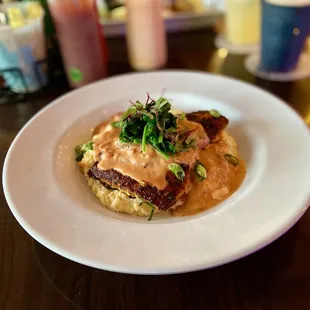 Blackened grouper on a bed of cheese grits.
