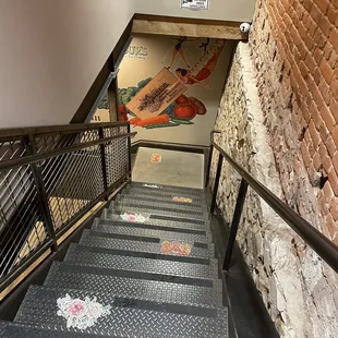 Stairway down to Shrunken Head Tiki Bar and also Bloom Ultra Lounge